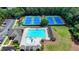 Aerial view of the tennis courts and pool, with playground and parking offering varied activities for residents and guests at 2875 Daniel Park Run, Dacula, GA 30019