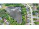 Aerial view of neighborhood pond, lush trees, and well-maintained landscaping at 2875 Daniel Park Run, Dacula, GA 30019
