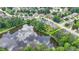 Aerial view of lakeside home with mature trees and lush landscaping and lake reflection of sky above at 2875 Daniel Park Run, Dacula, GA 30019