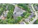 Aerial view of neighborhood pond, surrounded by trees and well-maintained homes at 2875 Daniel Park Run, Dacula, GA 30019