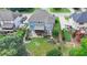 Expansive backyard features lush lawn, mature trees, playground, basketball court and a screened-in porch at 2875 Daniel Park Run, Dacula, GA 30019