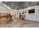 Finished basement with an entertainment area, bar seating, and stylish tile flooring at 2875 Daniel Park Run, Dacula, GA 30019