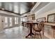 Finished basement with a bar area, seating, and access to the backyard through glass doors at 2875 Daniel Park Run, Dacula, GA 30019