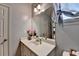 Bathroom featuring a vanity with sink, a mirror, and fresh decor, designed for relaxation and everyday convenience at 2875 Daniel Park Run, Dacula, GA 30019