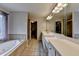 Relaxing bathroom featuring a soaking tub, white cabinets, and a large vanity at 2875 Daniel Park Run, Dacula, GA 30019
