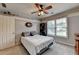 Inviting bedroom with ceiling fan, large window, and calming color palette at 2875 Daniel Park Run, Dacula, GA 30019