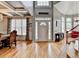 Open entryway with hardwood floors, chandelier, high ceilings, and front door with sidelights at 2875 Daniel Park Run, Dacula, GA 30019