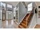 Inviting entryway featuring hardwood floors, staircase, and bright windows, creating a welcoming first impression at 2875 Daniel Park Run, Dacula, GA 30019