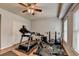 Home exercise room with laminate flooring, a ceiling fan, and workout equipment at 2875 Daniel Park Run, Dacula, GA 30019
