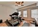 Home exercise room with laminate flooring, a ceiling fan, and workout equipment at 2875 Daniel Park Run, Dacula, GA 30019