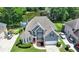 Stunning home with a well-manicured front yard, bay window, and attached two-car garage and views of a pond in the back at 2875 Daniel Park Run, Dacula, GA 30019