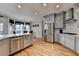 Spacious kitchen features stainless appliances and overlooks dining and living area at 2875 Daniel Park Run, Dacula, GA 30019