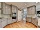 This kitchen features stone countertops, wooden floors and stainless steel appliances at 2875 Daniel Park Run, Dacula, GA 30019