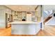 Bright kitchen features stainless steel appliances, a stone countertop island and lots of cabinet space at 2875 Daniel Park Run, Dacula, GA 30019