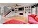 Spacious living room boasts hardwood floors, a fireplace, and custom built-ins at 2875 Daniel Park Run, Dacula, GA 30019
