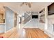 Open floorplan featuring a staircase, fireplace, built-in shelving and hardwood floors at 2875 Daniel Park Run, Dacula, GA 30019