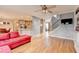 Bright living room with kitchen, dining area, staircase, hardwood floors, and fireplace at 2875 Daniel Park Run, Dacula, GA 30019