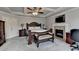 Spacious main bedroom featuring fireplace and a sitting area, designed for relaxation and style at 2875 Daniel Park Run, Dacula, GA 30019