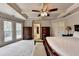Main bedroom with coffered ceilings and natural light, creating a sophisticated and airy atmosphere at 2875 Daniel Park Run, Dacula, GA 30019