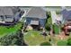 Aerial view of the home's backyard, featuring a screened porch, patio, and well-maintained lawn with a play area at 2875 Daniel Park Run, Dacula, GA 30019