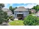 Exterior view of the home showcasing the screened-in porch, backyard, and landscaped surroundings at 2875 Daniel Park Run, Dacula, GA 30019