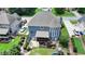 Aerial view of the home's backyard with a screened porch, patio, and green lawn, perfect for outdoor enjoyment at 2875 Daniel Park Run, Dacula, GA 30019