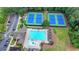 Aerial view showcasing community tennis courts and pool, perfect for recreation and socializing at 2875 Daniel Park Run, Dacula, GA 30019