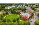 Aerial view of the community featuring pool, clubhouse, trees and landscaping at 1604 Gilstrap Nw Ln, Atlanta, GA 30318
