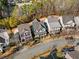 Aerial view of homes showcasing neat landscaping, roof tops and neighborhood street at 1604 Gilstrap Nw Ln, Atlanta, GA 30318
