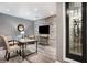 Finished basement space with stone accent wall, stylish flooring, wine storage and comfortable seating area at 1604 Gilstrap Nw Ln, Atlanta, GA 30318