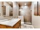 Beautiful bathroom featuring a marble countertop, tiled shower with glass door, and modern fixtures at 1604 Gilstrap Nw Ln, Atlanta, GA 30318