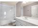 Bathroom featuring a white vanity and shower over tub at 1604 Gilstrap Nw Ln, Atlanta, GA 30318