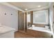 Bathroom featuring a glass enclosed shower and soaking tub at 1604 Gilstrap Nw Ln, Atlanta, GA 30318