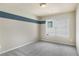 Bedroom with blue stripe and a light neutral paint at 1604 Gilstrap Nw Ln, Atlanta, GA 30318