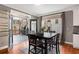 Dining area with access to screened porch, features modern table set, and abundant natural light at 1604 Gilstrap Nw Ln, Atlanta, GA 30318