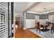 Elegant dining room with hardwood floors, modern chandelier, and stylish furnishings at 1604 Gilstrap Nw Ln, Atlanta, GA 30318
