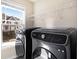 Laundry room with new, modern front load washer and dryer at 1604 Gilstrap Nw Ln, Atlanta, GA 30318