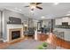 Spacious living area featuring a fireplace, adjacent dining space, and convenient access to the kitchen and outdoor deck at 1604 Gilstrap Nw Ln, Atlanta, GA 30318