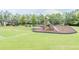 Community playground featuring swings, slides, and lush green lawn at 1604 Gilstrap Nw Ln, Atlanta, GA 30318