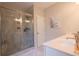 Bathroom features a glass enclosed shower, large counter, and modern fixtures at 2247 Pink Hawthorn Dr, Buford, GA 30518