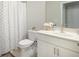 Clean bathroom with a shower and tub combination featuring a patterned shower curtain at 2247 Pink Hawthorn Dr, Buford, GA 30518