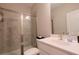 Bright bathroom features a glass-door shower, white vanity, and modern fixtures at 2247 Pink Hawthorn Dr, Buford, GA 30518