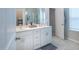 Well-lit bathroom featuring double sinks, modern fixtures, and plenty of counter space at 2247 Pink Hawthorn Dr, Buford, GA 30518