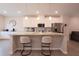 Modern kitchen featuring white cabinetry, granite countertops, and a spacious island with seating at 2247 Pink Hawthorn Dr, Buford, GA 30518
