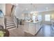 Modern kitchen with granite countertops, stainless steel appliances, and a view of the staircase at 2247 Pink Hawthorn Dr, Buford, GA 30518