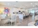 Bright and airy kitchen with white cabinets, an island with seating, and stainless steel appliances at 2247 Pink Hawthorn Dr, Buford, GA 30518