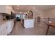 Modern kitchen with an island, stainless steel appliances, and view into the dining area at 2247 Pink Hawthorn Dr, Buford, GA 30518