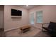 Inviting living space features neutral decor, modern furnishings, and a door that fills the room with light at 2247 Pink Hawthorn Dr, Buford, GA 30518