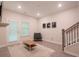 Inviting living space features neutral decor, modern furnishings, and a door that fills the room with light at 2247 Pink Hawthorn Dr, Buford, GA 30518