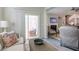 Comfortable living room with sliding glass door, neutral decor, and plenty of natural light at 2247 Pink Hawthorn Dr, Buford, GA 30518